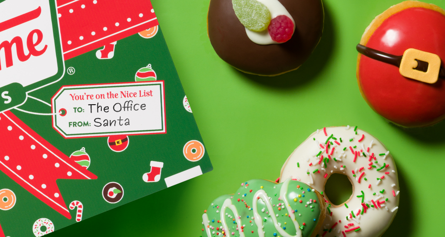 Krispy Kreme Christmas Doughnuts - Green background, flatlay with christmas packaging and christmas doughnuts featured