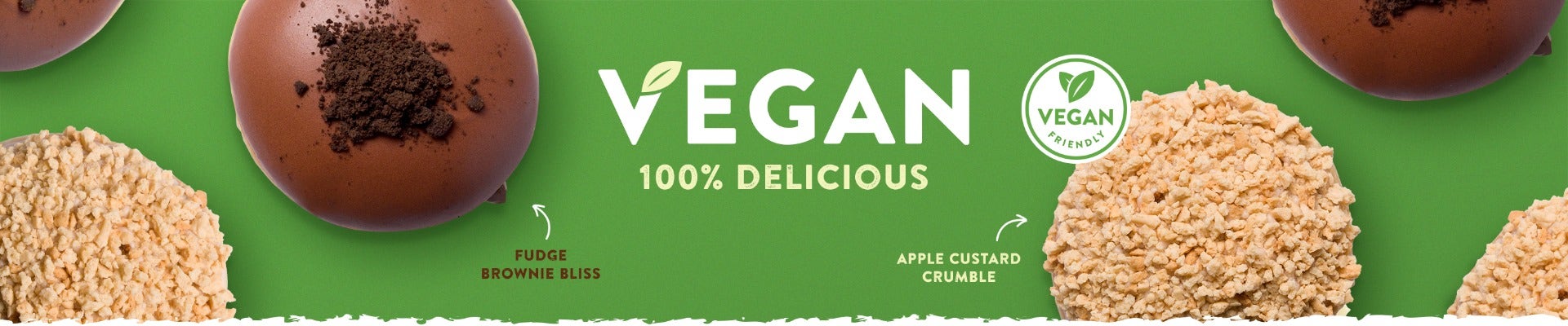 Krispy Kreme Vegan Friendly Range - New and For a Limited Time! Vegan 100% Delicious banner featuring a gree background, and the two Vegan Friendly Doughnuts by Krispy Kreme - Apple Custard Crumbe and Fudge Brownie Bliss - both featured in a flat lay position - Vegan Friendly Logo