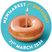 A single Original Glazed Doughnut with a candle in the middle to signify the Newmarket Store's first Birthday, celebrating a year in this location